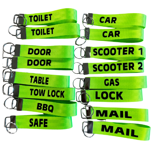 Set of green safety straps with labels on a white background
